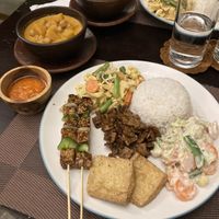Nasi campur which you can DIY yourself. I chose sweet tempeh, sate tempeh, tofu, veg rendang, chickpea and pumpkin curry, and coconut veg.   at Lockdown Kitchen in 