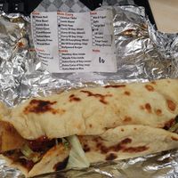 Chickpea and potato curry naan wrap with chilli sauce and salad at Curry Rolls in Gateshead