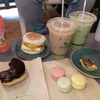 Donut, breakfast sandwich, cardamom soy latte, matcha oat latte, and macarons at Logan Vegan  in Chicago