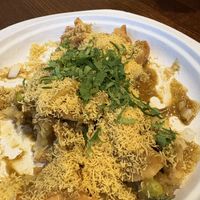 Samosa chaat. Pieces of samosa covered with onions, chick peas, and tamarind sauce. So good.   at Tiranga (by P&D) in Quincy