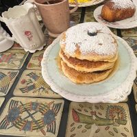 Pancakes with berries, banana and maple syrup + a coffee with warm soy milk   at Coromandel in Rome