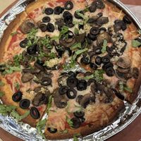 Cauliflower Crust, vegan “Pleese Cheese”, mushrooms, olives, garlic & basil    at Luigi's Pizzeria in Mineola