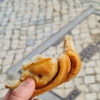 A cinnamon roll almost finished as it was delicious at All Things Dough in Lagos