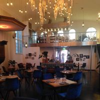 Very cosy indoor setting and view on the kitchen located where the church choir used to perform at Restaurant Oost in Roosendaal