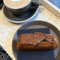 Latte machiatto with hazelnutcream pastry  at WAY Plant Based Bake House in Ghent