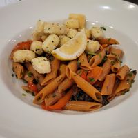 Chef's vegan creation for us - red lentil pasta, fried tofu, maitake mushrooms, peppers, cherry tomatoes at Down Island Gulf Seafood Restaurant in Santa Rosa Beach