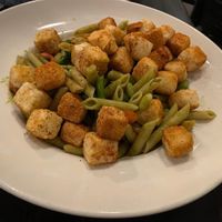 High protein pasta with tofu, broccolini, peppers and medley of sauces marinara, chimichurri, and romesco.   at Down Island Gulf Seafood Restaurant in Santa Rosa Beach