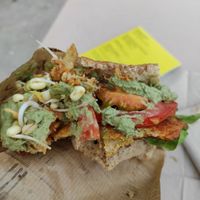 Vegan and bio sandwich made with fresh vegetables, lentil burger, sprouts, green pesto and lentil burger. at Linsenmanufaktur in Kassel