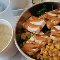 Udon bowl with teriyaki tofu and spicy peanut sauce, side of miso soup at Rice Bar - Market Place in Washington