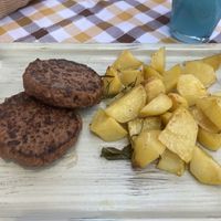 100% vegan burger with potatoes   at Anca Massa in Lido Di Jesolo