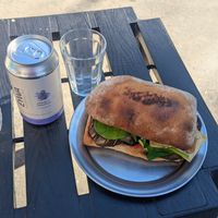 Kombucha y sandwich de berenjena con tofu en vez de queso at Hola Chola Garage in Buenos Aires