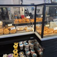 Pastry counter (green outlined signs are vegan)  at Gregorys Coffee in Washington