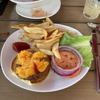 Impossible burger with vegan cheeze and a few tots behind    at Bay Cafe in Provincetown