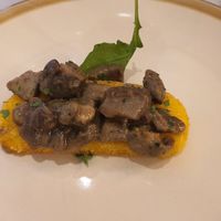 Fried polenta with mushrooms (1 out of 2 in the dish) at Carnalmente in Assisi
