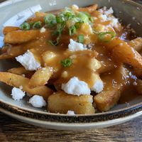 Poutine w/ vegan feta  at Iron Bay Restaurant & Drinkery in Marquette