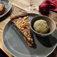 Chocolate tart and pistachio icecream at Ortica Italian Plant Based in Urmston