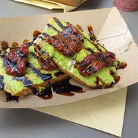 Avocado sourdough toast with sun-dried tomatoes and balsamic glaze at Squeezee in Barmouth