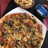 Vegan pizza and hot chips   at Can Paco in Blanes