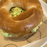 Avocado, chilli, lemon bagel  at Reubens Cafe & Coffee in Holyhead