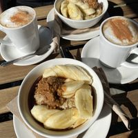 Chai tea and Porridge with banana and almond butter.  at Living Room Club in North West London
