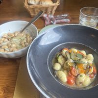 Vegan gnocchi and beans and onions as a side dish   at Osteria Al Fureghin in Burano