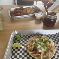 Chicharrón taco and Alitas in the backgroundd  at VegMex in La Paz