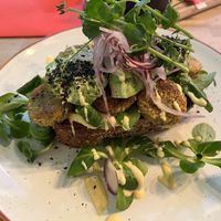 Toast with falafel and avocado and curry hummus   at Lola's in Genk