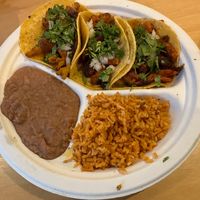 Three tacos platter with rice and beans  at Rojos Mexican Food in Seattle