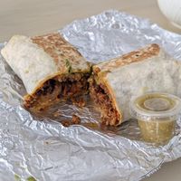 Avocado burrito with asada, plus green salsa at Rojos Mexican Food in Seattle