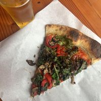 Vegan slice and a helles lager   at Pizza Thief in Portland