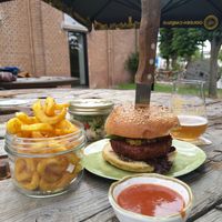 Vegan red beetroot burger with curly fries, homemade ketchup and a salad at Batteliek in Mechelen