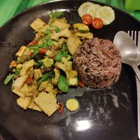 Rice topped with stir fried tofu, mushroom and basil at Kwanjai Thai food in Pai