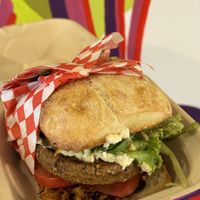 This plant-based vegan burger did not disappoint. All the savory flavors and textures were there. I loved the coconut bacon and the ciabatta roll topped it:  at Plant Based Paradise - Kaimuki in Honolulu