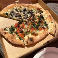 vegan wild mushroom pizza (top) and “vegani” pizza (bottom)  at Roscoe's Pizzeria in Takoma Park
