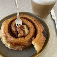 Cold latte with Oatly 😍 and cinnamon roll  at Ave Pastelería Artesanal in Gran Canaria