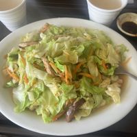 Cabbage salad with mushrooms served with guayaba juice  at Pu Ti in San Jose