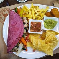 Quesadillas with vegan cheese, vegan bacon, vegan chicken, French fries, guacamole etc etc!  at Caravanserai in San Sebastian