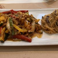 Vegan chicken with teriyaki sauce, wok-fried vegatables with sesame and soy sauce and sauteed Chinees noodles with mushrooms  at Caravanserai in San Sebastian
