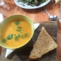 Coconut and sweet potato soup, homemade bread. at Art Cafe in Holt