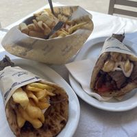 Vegan souvlaki on the left, gyro on the right and a side of French fries  at Piatsa Souvlaki Grill House Oia in Oia