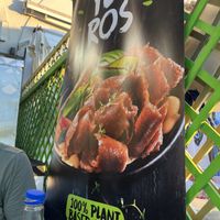 Big plant based sign for Mega Meatless  at Piatsa Souvlaki Grill House Oia in Oia