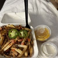 When you DoorDash, the cheese and sour cream come on the side    at Vegan Van @ Park Hill Kitchens in Denver