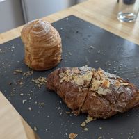 Almond-filled croissant and cruffin (mix of a muffin and a croissant), we were so eager to eat them that we forgot to take a picture before cutting them 😅 at Octopus in Brest