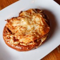 Vegan Bratzel - pretzel topped with vegan brat and dairy-free cheese (Vegetarian available) at Kansas City Bier Company in Kansas City