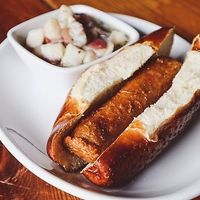 Vegan Bratwurst - served on pretzel bun; pictured with Potato Salad (vegan) at Kansas City Bier Company in Kansas City