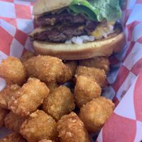 tots and mac burger omnomnomnomnom   at Romeos Vegan Burgers in Greensboro