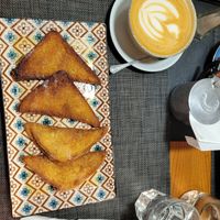 Big oatmilk cappuccino and french toast at Caffè dell'Arte Specialty Coffee in Cagliari