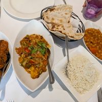 L-R aubergine bhaji, curry, roti bread, rice, chickpea curry at Ghandi Indian Restaurant in Winchester