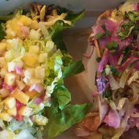 Custom vegetable tacos: one in a lettuce wrap with mango salsa, romaine and pineapple plus veggies/squash. Another in crispy corn tortilla with pickled onions, cabbage, romaine, ci at Turco Taco in Naples