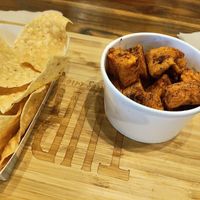 Side of tortilla chips and side of roasted sweet potatoes made by special request at Turco Taco in Naples